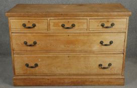 A 19th century pitch pine chest with three frieze drawers on plinth base. H.82 W.122 D.52cm