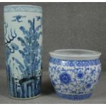 A 20th century Chinese blue and white hand painted umbrella stand decorated with animals and