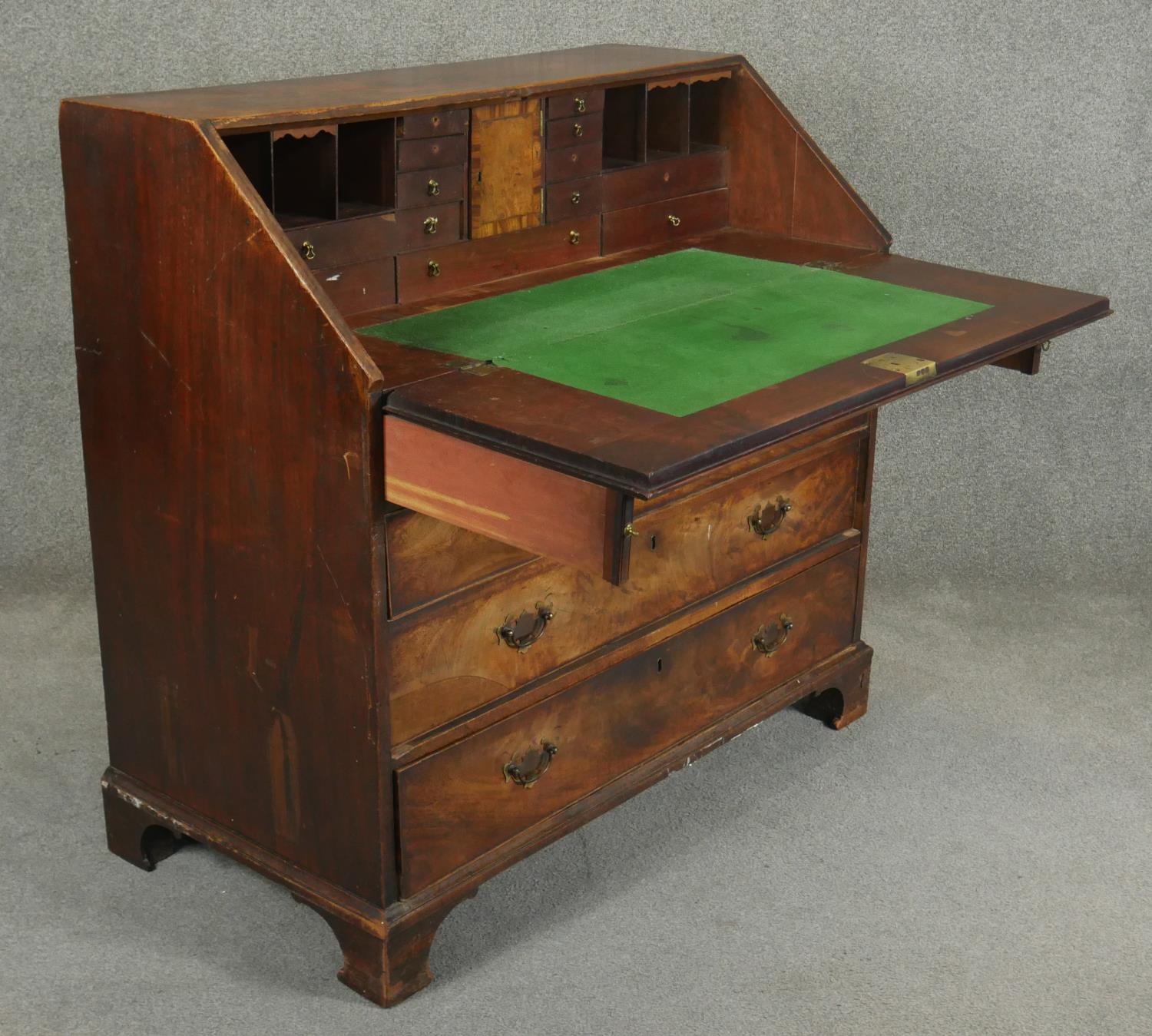 A Georgian mahogany bureau the fall front revealing inlaid and fitted interior above four long - Image 3 of 6