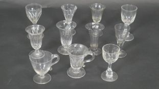 A collection of eleven 19th century blown glass cordial, posset and drinking glasses. Largest H12cm