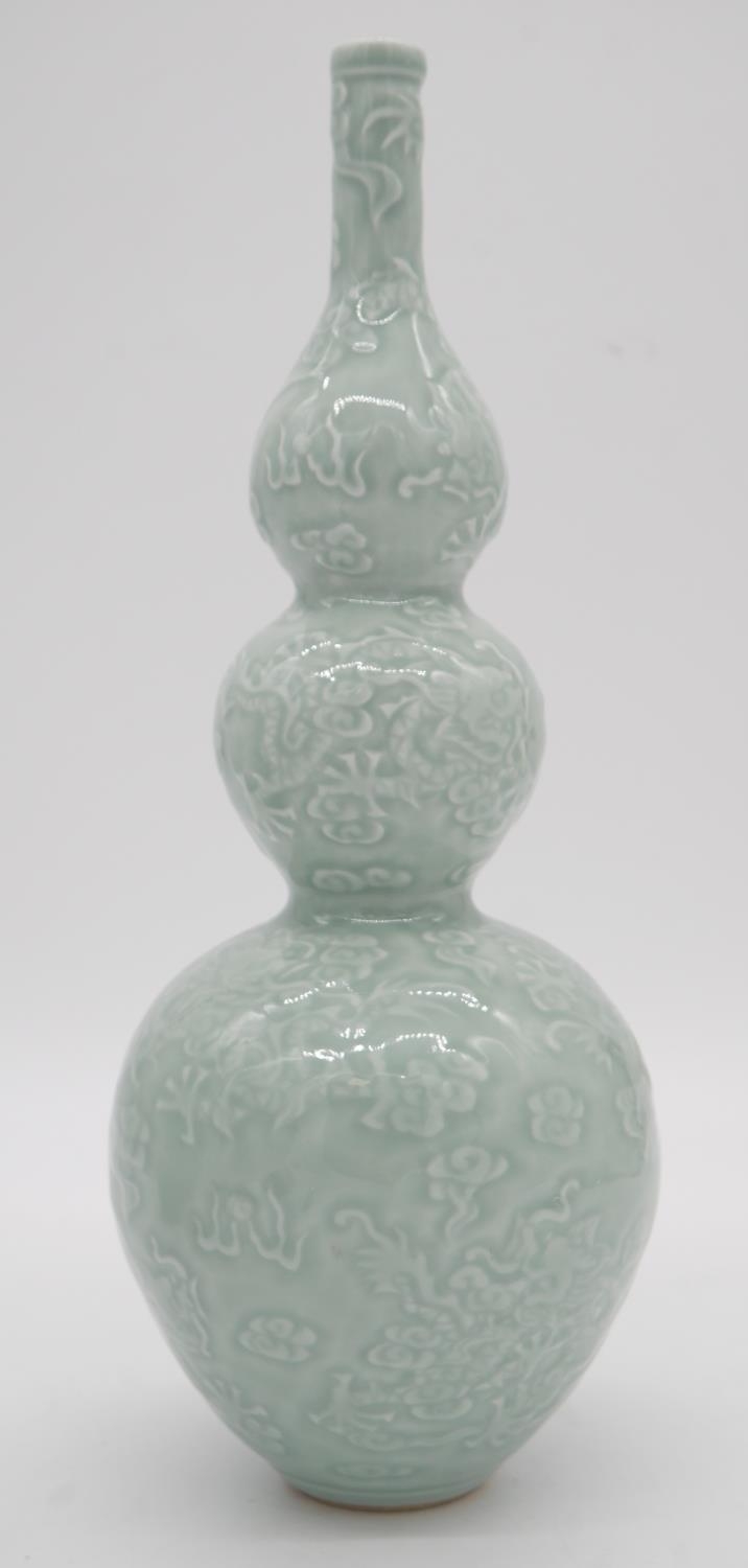 A pair of Chinese green celadon glaze dragon design triple gourd vases. Qianlong mark to the - Image 3 of 5