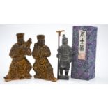 A pair of Tang style salt glaze ceramic tomb attendants, one playing an instrument along with a