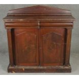 A mid 19th century flame mahogany chiffonier with raised back above frieze drawers and arched