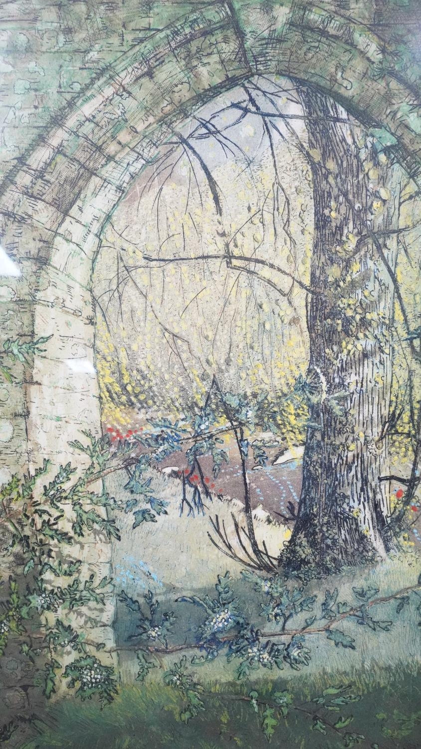A framed and glazed lithograph of a garden with stone archway. Signed. (Mount slipped, signature