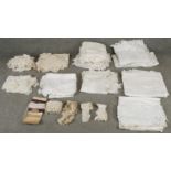 A large collection of antique and vintage lace and crocheted items. Including table cloths,