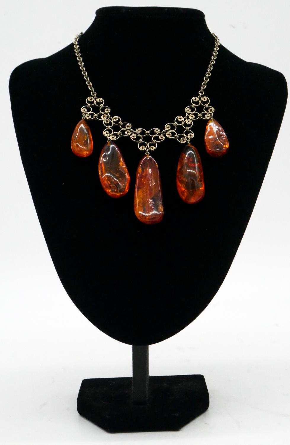 An amber bead elasticated bracelet along with a graduated amber drop necklace with scrolling - Image 2 of 6