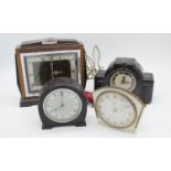 Four Art Deco mantle clocks. Including two brown bakelite clocks. H.22cm