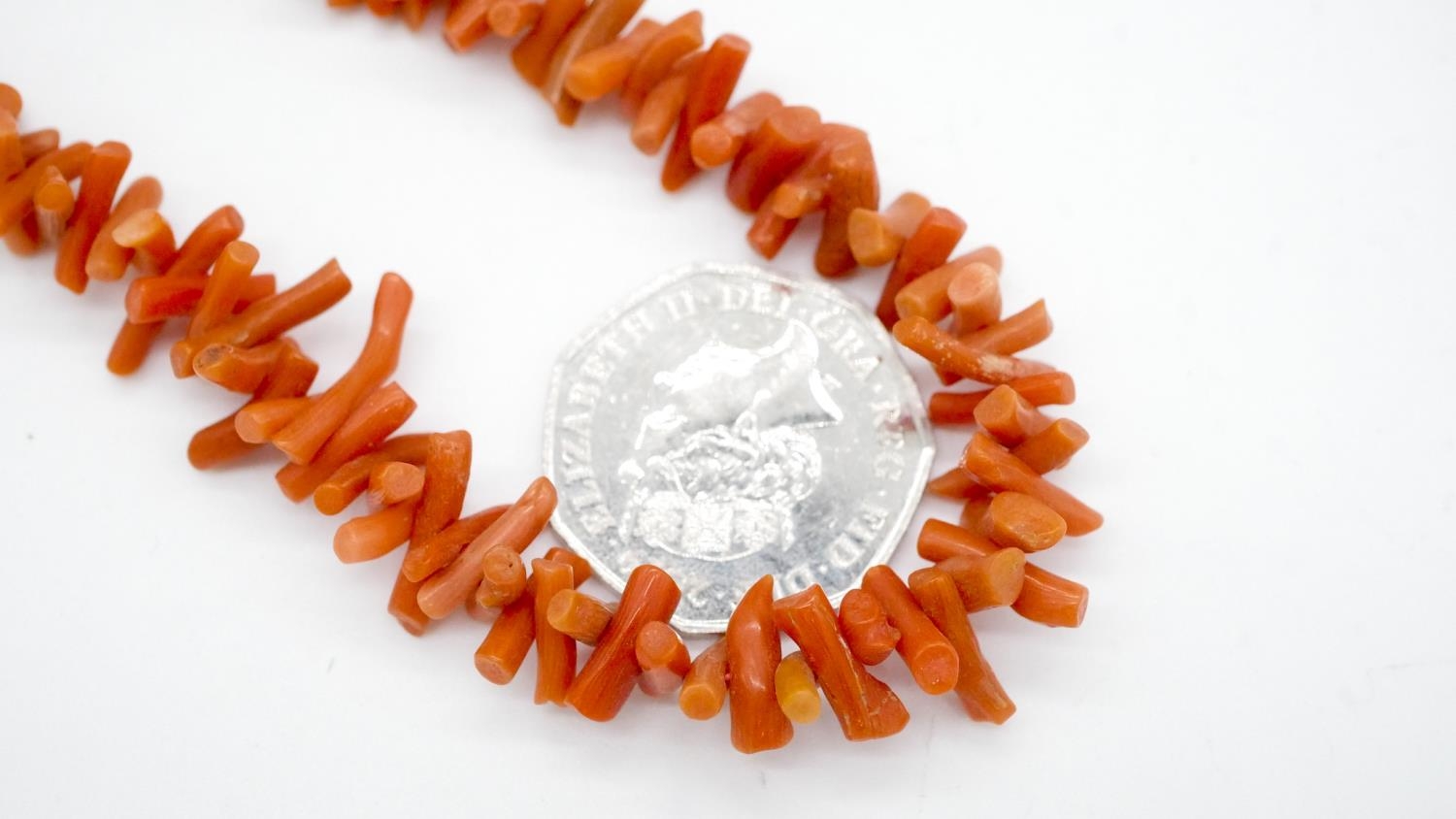 Two coral necklaces. One comprising of graduated sections of red branch coral and polished round - Image 8 of 8