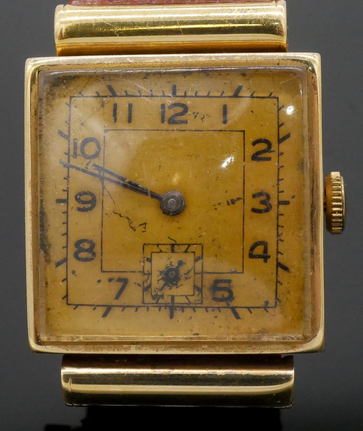 A 14 carat yellow gold vintage mens watch with gold colured dial and black numerals on a brown - Image 2 of 4