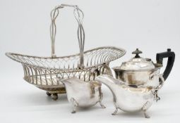 A collection of silver plate. Including a swing handled pierced basket, two C-scroll handled gravy