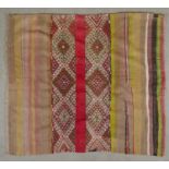 A Sumak Kelim rug in multiple colours. L.146 W.134cm