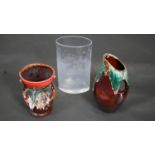 A collection of glass and pottery. Including a clear oval glass vase and two lava glaze pieces. A