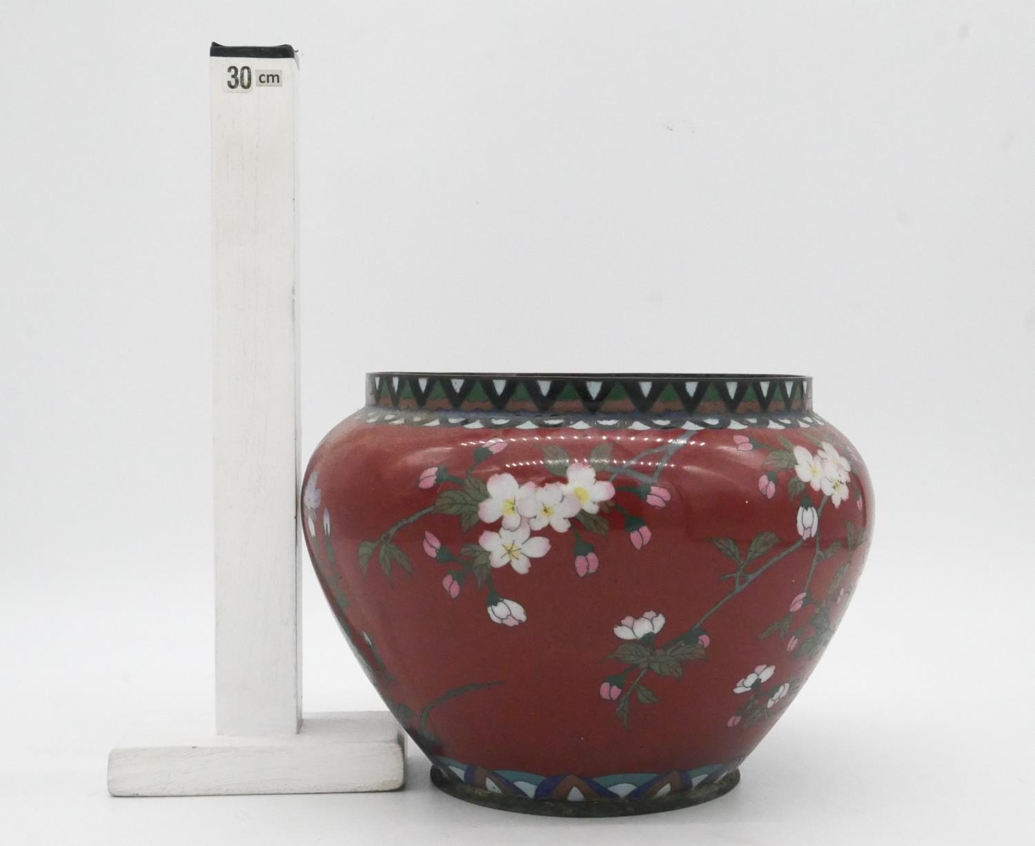 A Meji period Japanese cloisonne enamel on brass jardinere with red ground and decorated with - Image 5 of 5