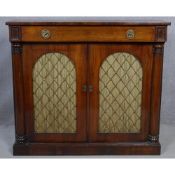 A Regency rosewood chiffonier with frieze drawer above arched metal grille doors and pleated silk