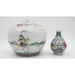 A Chinese porcelain Famille Verte lidded ginger jar decorated with warriors on horse back along with