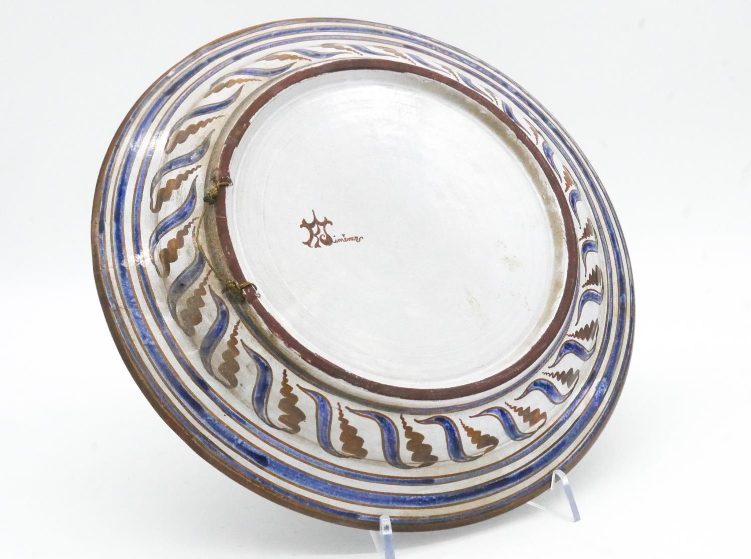 Two Islamic and Greek hand painted plates with a stylised floral design, signed to back. D.31cm - Image 6 of 8