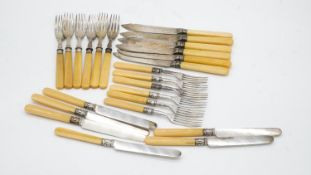 Two sets of twelve person silver plated cutlery. One set of fish knives and forks wuth engraved