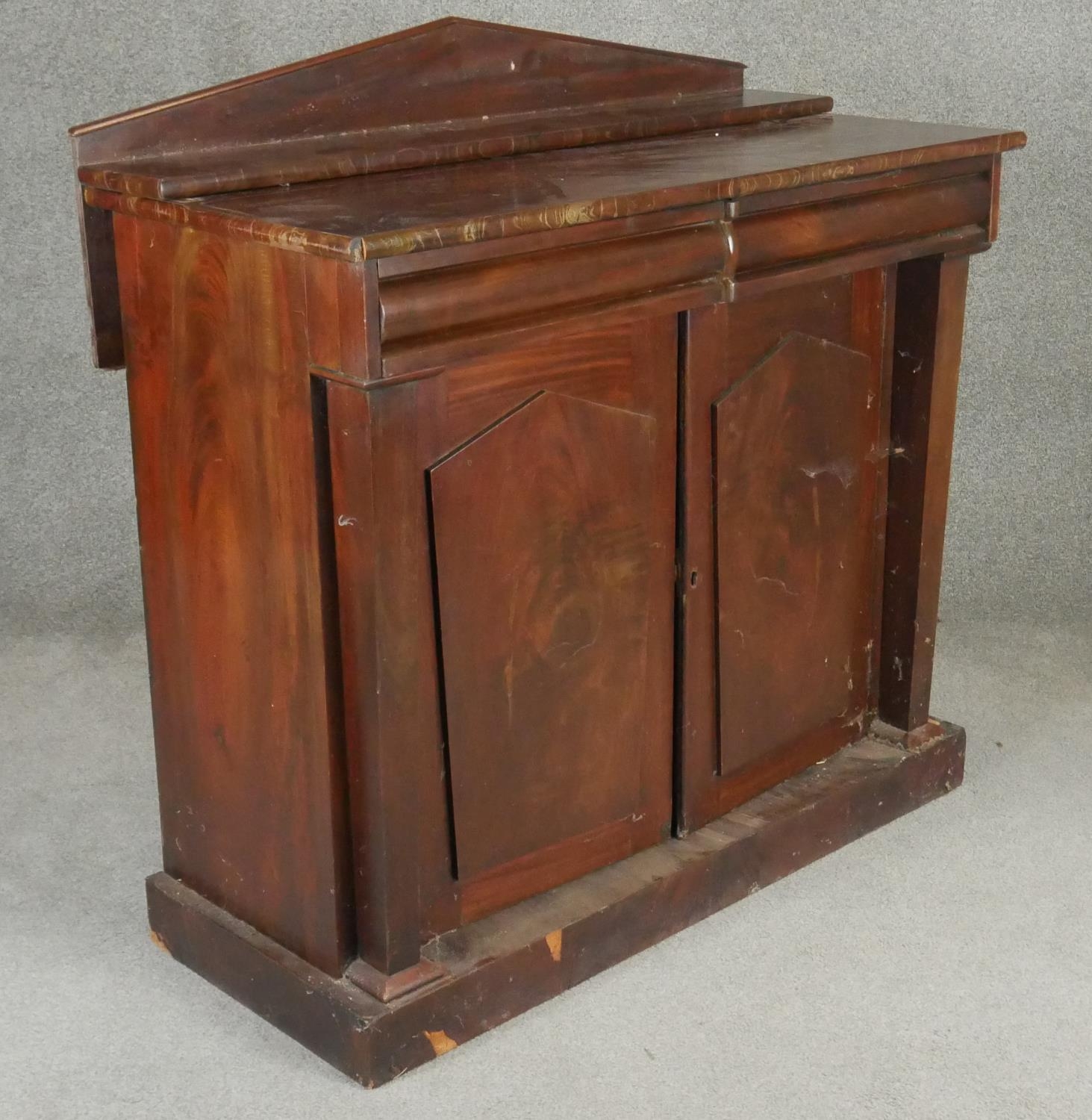 A mid 19th century flame mahogany chiffonier with raised back above frieze drawers and arched - Image 3 of 7