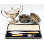 A collection of silver plate including a silver plated fish serving set, a two handled urn design