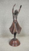 After Demeter Chiparus - An Art Deco style bronze sculpture of a young dancer in period clothing