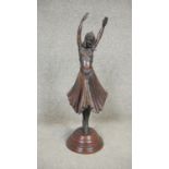 After Demeter Chiparus - An Art Deco style bronze sculpture of a young dancer in period clothing