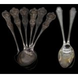 Eight silver tea spoons. A set of six Scottish repousse design tea spoons, hallmarked: W.C. for