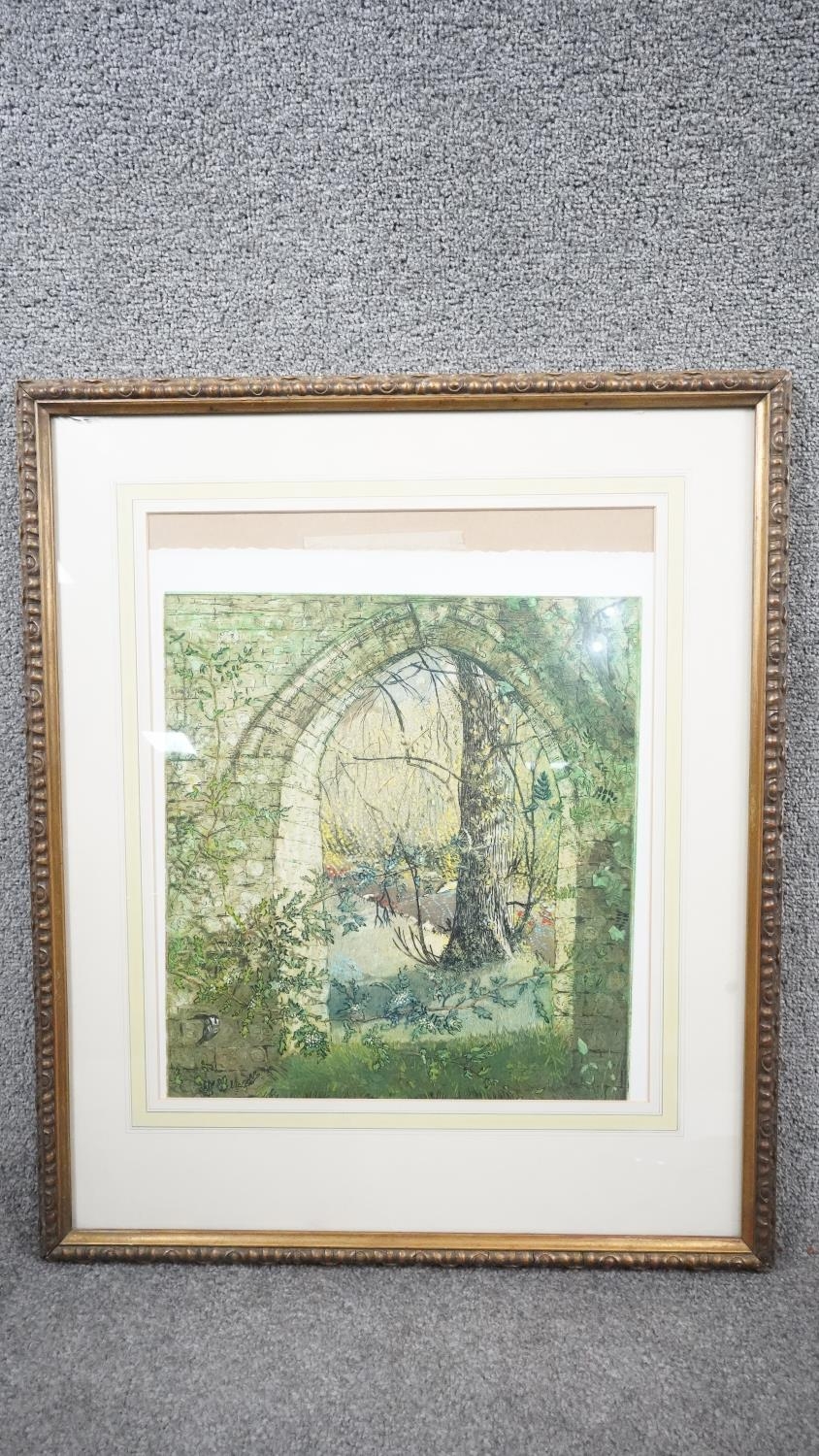 A framed and glazed lithograph of a garden with stone archway. Signed. (Mount slipped, signature - Image 2 of 5