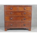 A 19th century mahogany chest with turned knob handles on shaped bracket feet. H97 W103 D50