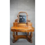 A Victorian satin birch Duchess style dressing table fitted with an arrangement of drawers. H.154