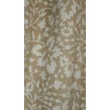A pair of taupe ground stylised floral and foliate design lined curtains. With a pair of tie
