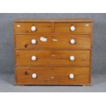 A Victorian pine chest of drawers with porcelain knob handles. H85 W99 D51cm