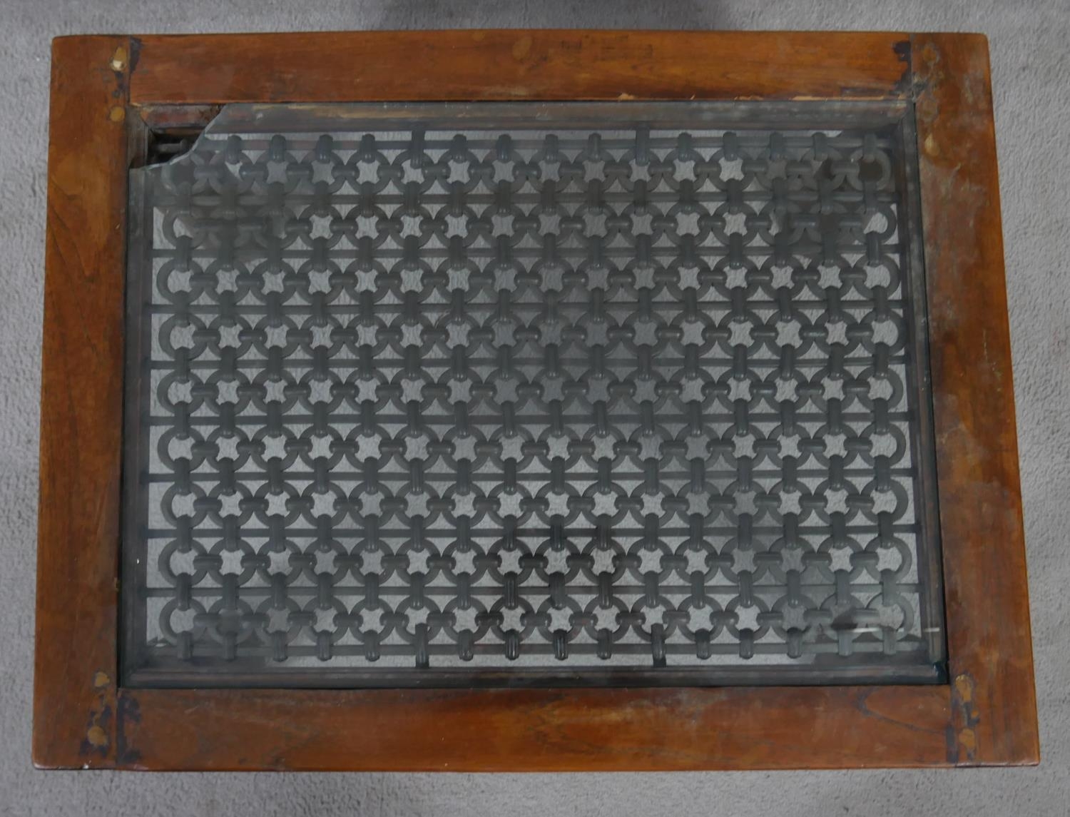 An Indian hardwood occasional table with plate glass on a metal lattice work inset top. H.38 L.68. - Image 2 of 5