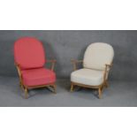 A pair of vintage light beech framed Ercol style easy armchairs.