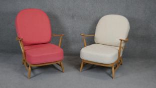 A pair of vintage light beech framed Ercol style easy armchairs.