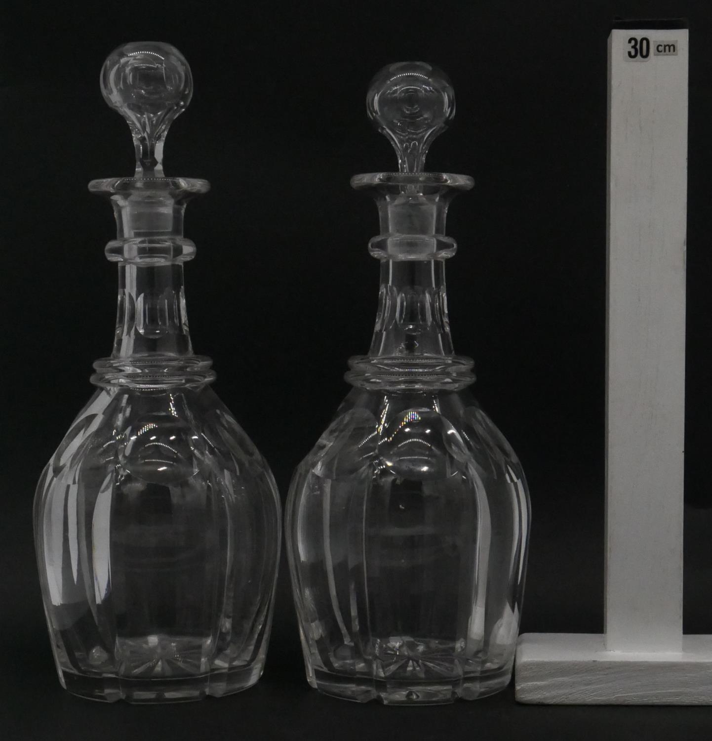 A pair of Victorian cut crystal decanters with original stoppers and star cut bases. H.29cm - Image 8 of 8