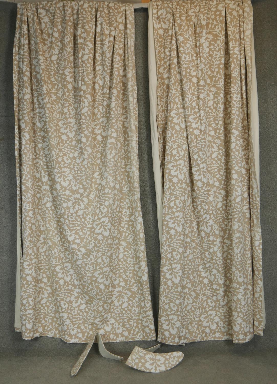 A pair of taupe ground stylised floral and foliate design lined curtains. With a pair of tie - Image 2 of 4