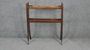 A C.1900 stained beech towel rail on swept supports. H80 W67cm