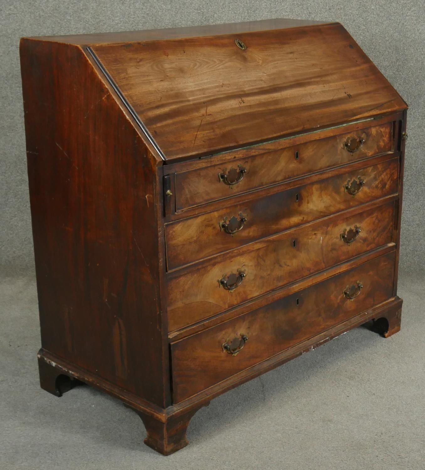 A Georgian mahogany bureau the fall front revealing inlaid and fitted interior above four long - Image 2 of 6