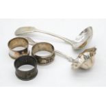 A collection fo white metal and silver items. Including two white metal napkin rings one with