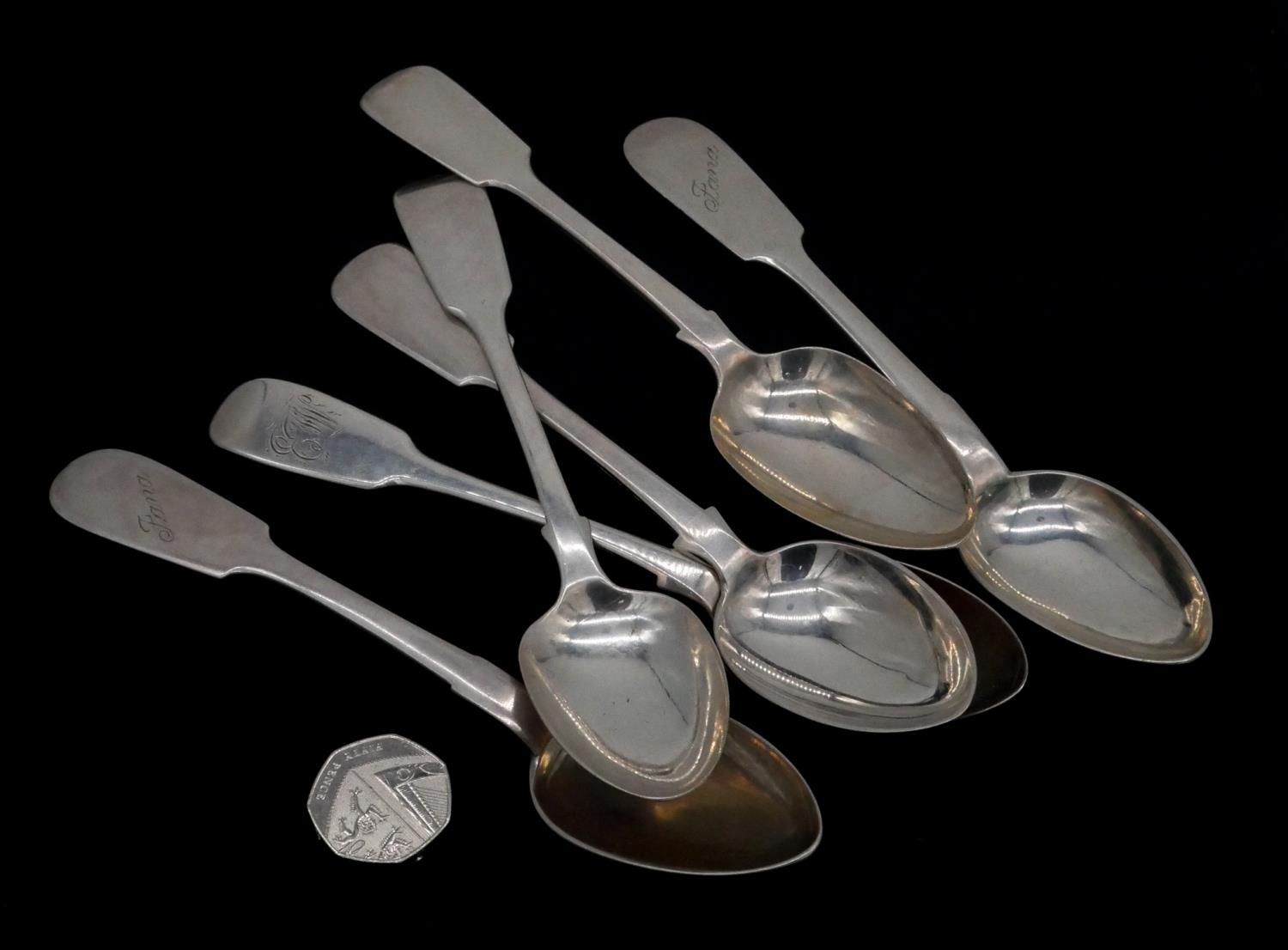 A collection of six silver dessert spoons. Including a pair of Russian silver spoons, maker