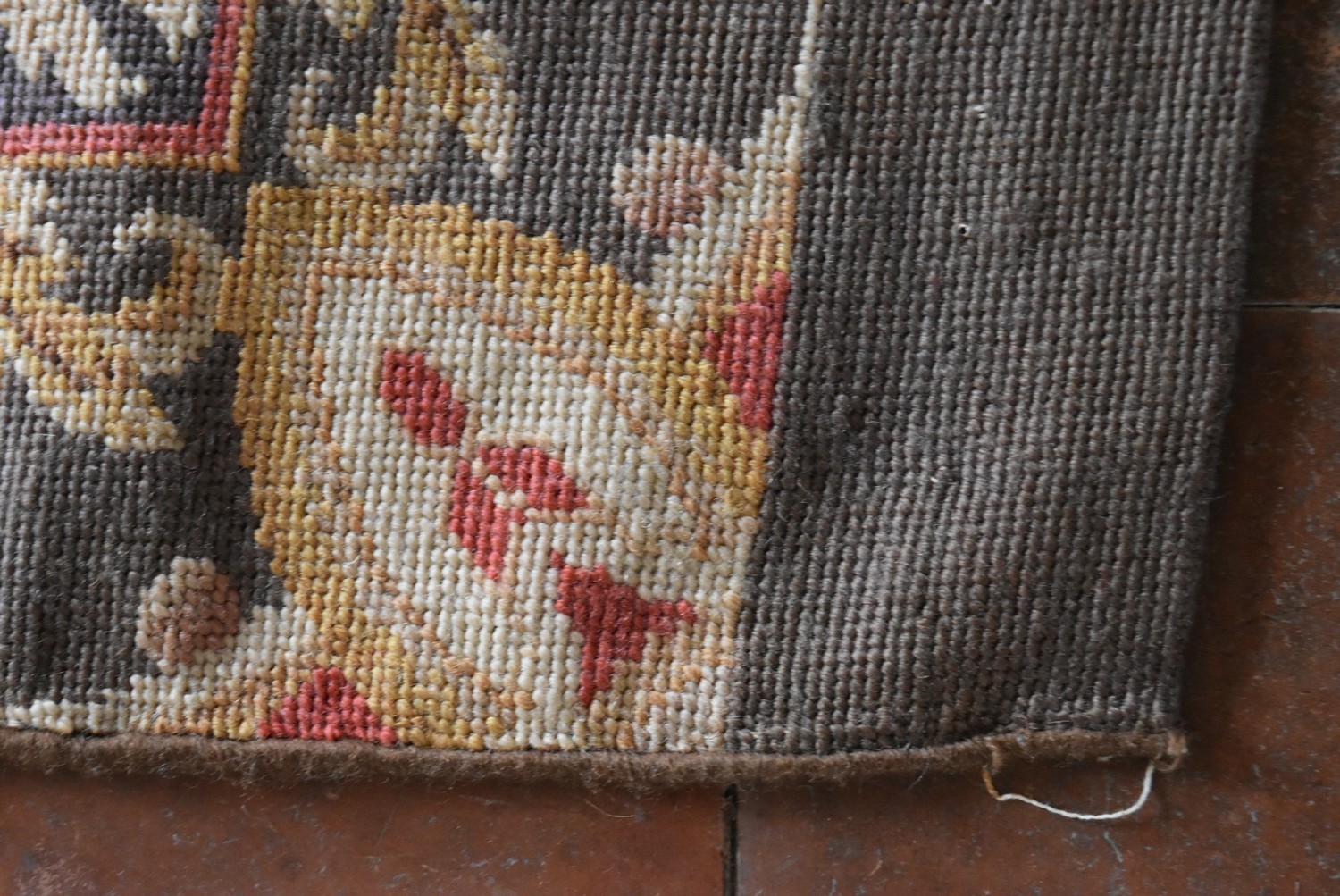 A needlepoint runner with repeating floral spray medallions on a foliate ground. L.420 W.57cm - Image 3 of 4