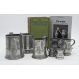 A collection of 19th century pewter and two books on the history of pewter. The measures are a
