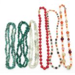 A collection of six gemstone and lacquer necklaces. Including a double stranded faceted green