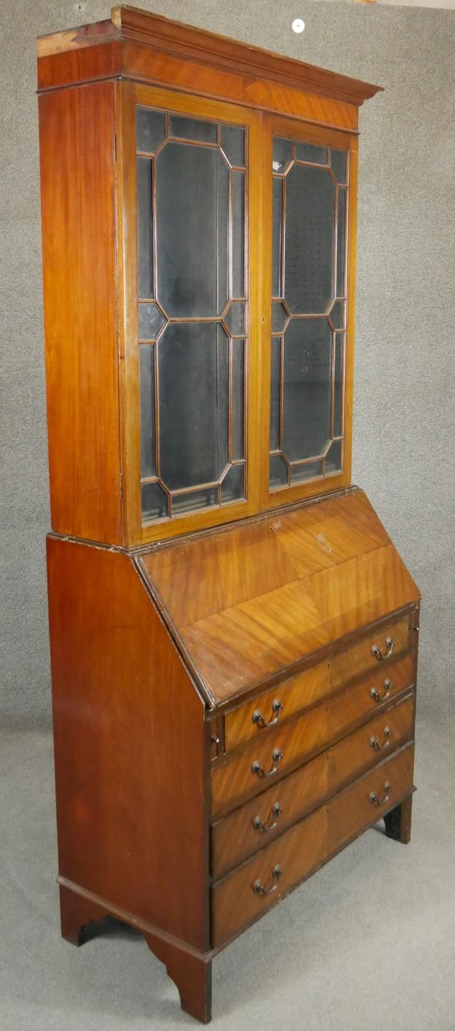 An Edwardian quarter veneered mahogany bureau bookcase with leather lined fall front and fitted - Image 6 of 8