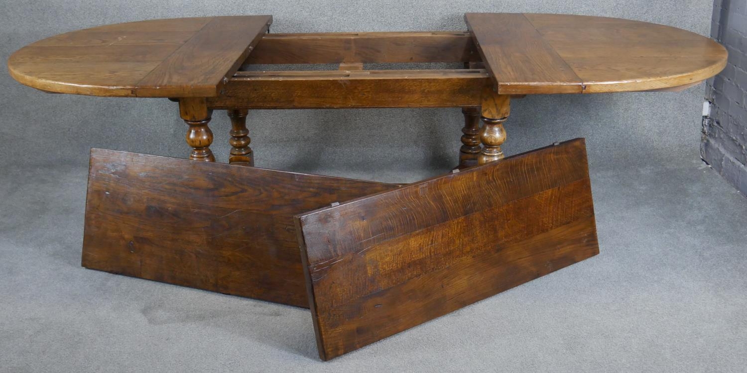 An antique style Ipswich oak extending dining table with two extra leaves on baluster turned - Image 4 of 7