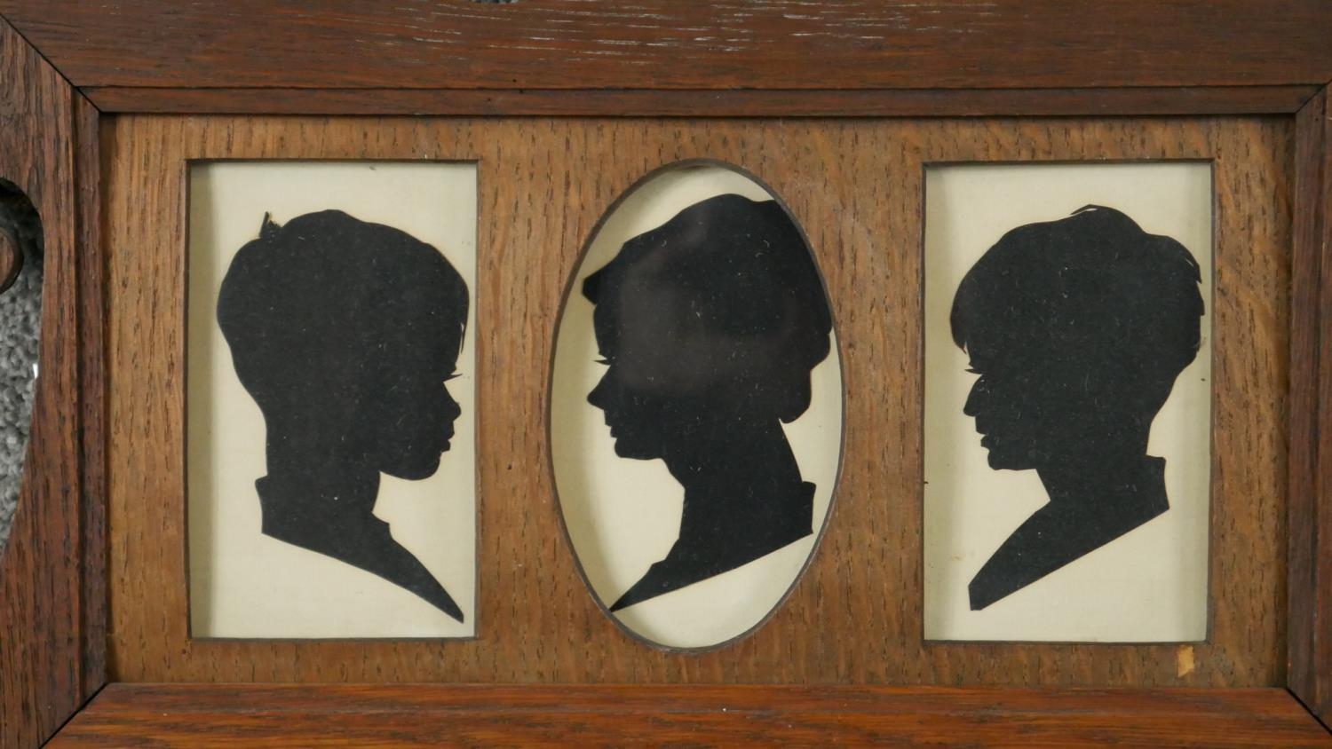 An Art Nouveau oak frame with three silhouette paper cut outs of children along with two lithographs - Image 2 of 6