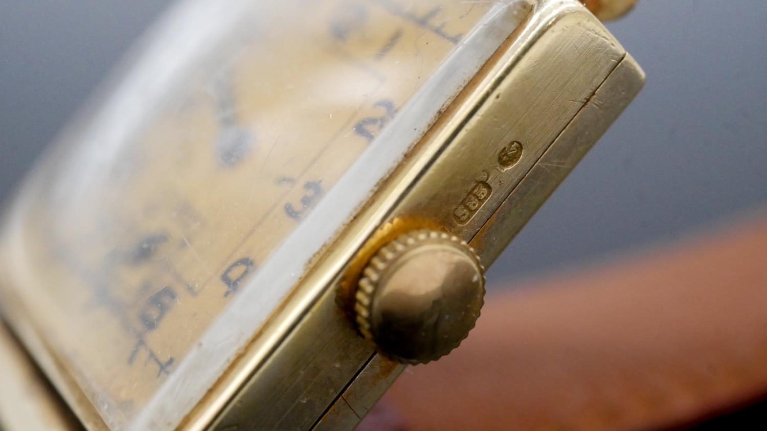 A 14 carat yellow gold vintage mens watch with gold colured dial and black numerals on a brown - Image 3 of 4