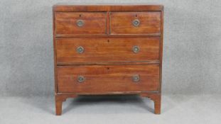 A small Regency mahogany chest of two short above two long drawers on bracket feet. H90 W87 D47cm
