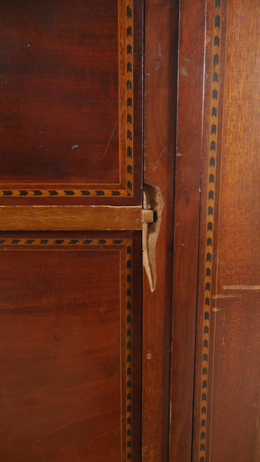 A C.1900 mahogany triple section compactum wardrobe with satinwood scrolling foliate, ribbon and - Image 7 of 9