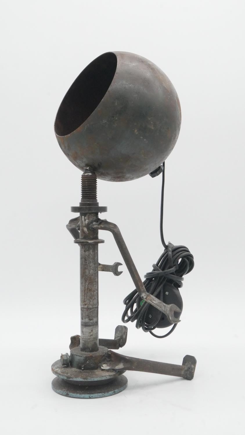 An industrial table lamp in the form of a seated figure with shade for the head. H.45cm - Image 2 of 4